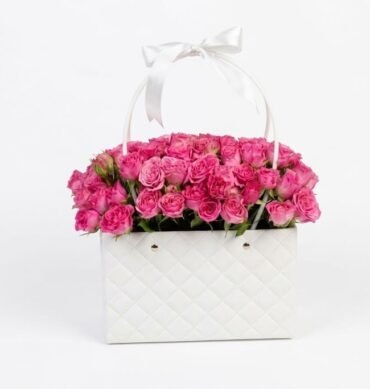 Dark pink spray roses inside the bag