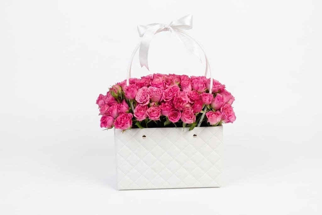 Dark pink spray roses inside the bag