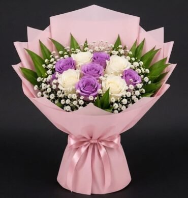 Purple and white roses with accessories
